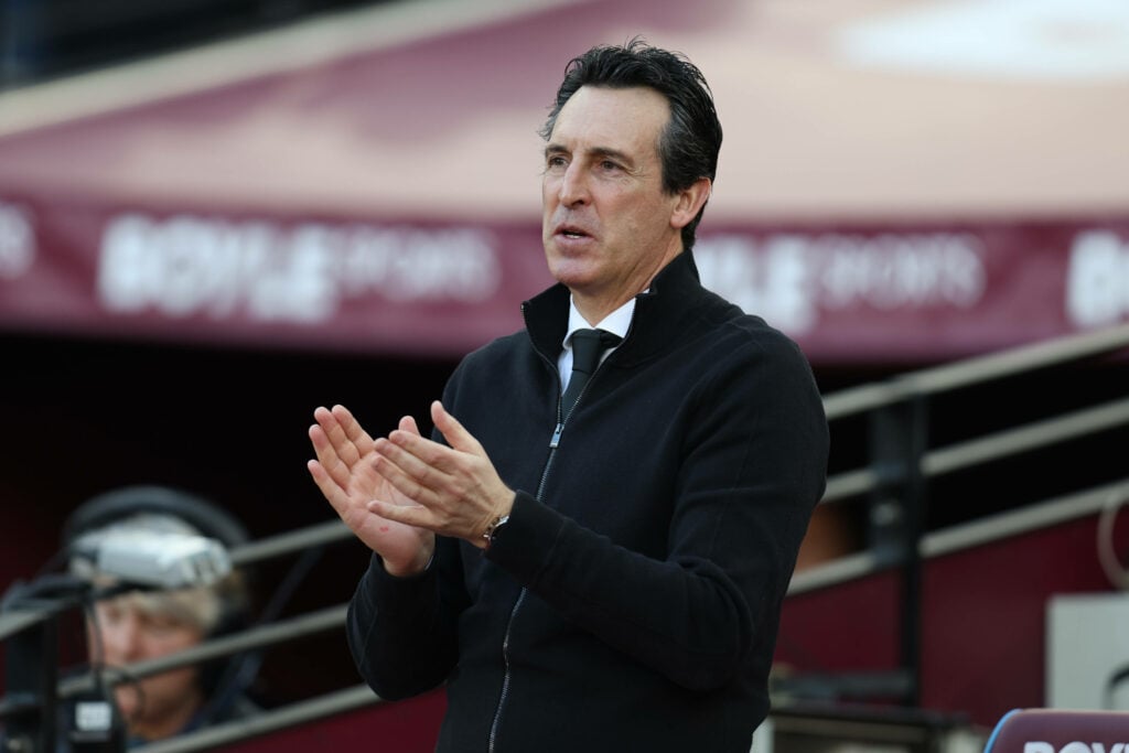 Aston Villa manager Unai Emery applauds while looking nervous on the touchline.