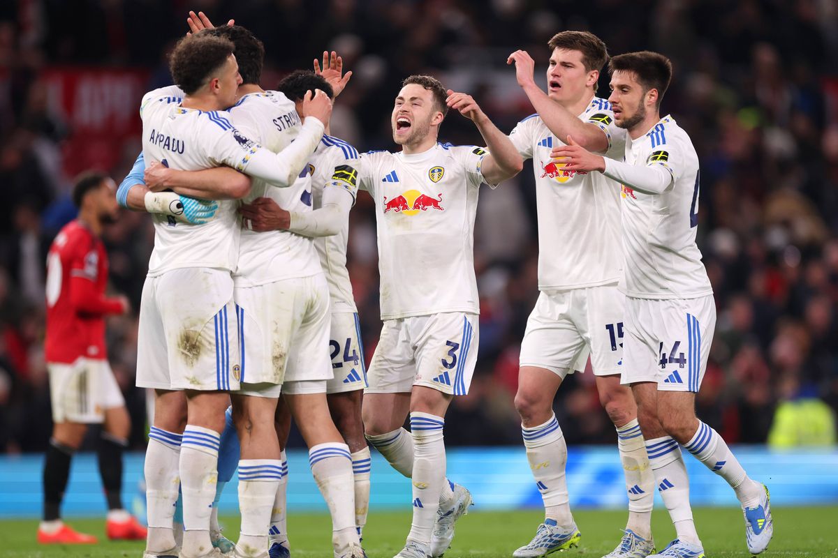 Gabriel Gudmundsson, Jaka Bijol and Ilia Gruev celebrate with team mates after the team's victory in the Premier League match between Manchester United and Leeds United at Old Trafford. 
