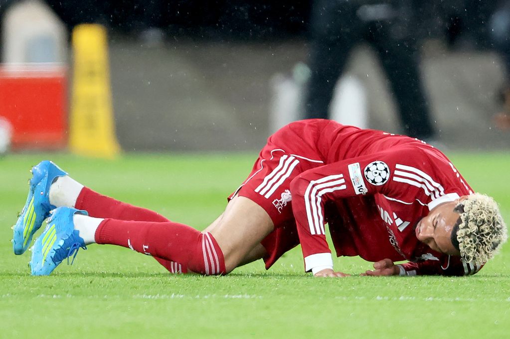 Hugo Ekitike of Liverpool is injured during the UEFA Champions League 2025/26 Quarter-Final Second Leg match between Liverpool FC and Paris Saint-Germain FC at Anfield on April 14, 2026 in Liverpool, England
