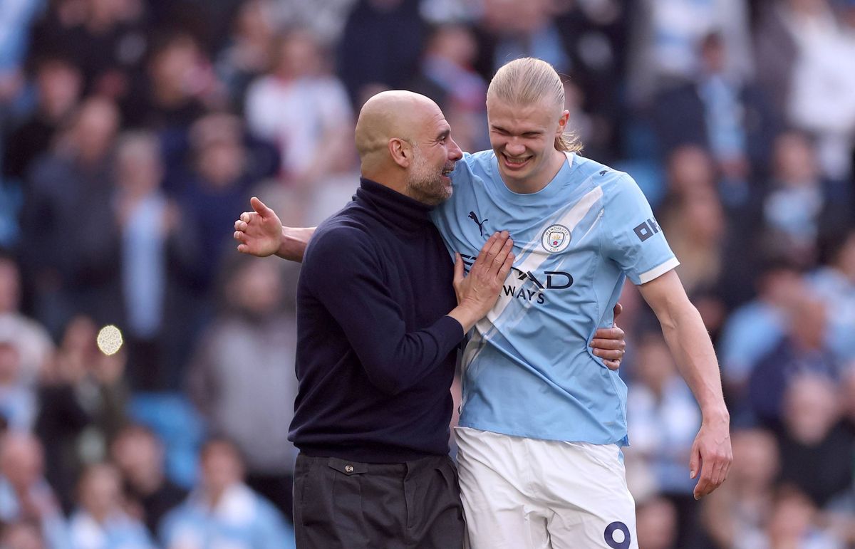 Pep Guardiola and Erling Haaland celebrate victory over Arsenal