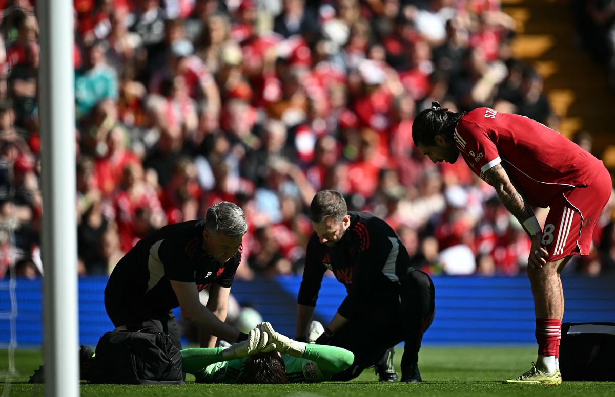 Liverpool's English goalkeeper #28 Freddie Woodman receives medical treatment during the English Premier League football match between Liverpool and Crystal Palace at Anfield in Liverpool, north west England on April 25, 2026