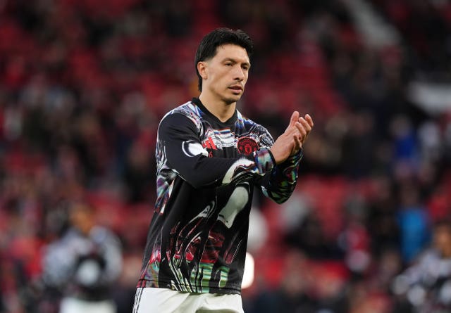 Manchester United’s Lisandro Martinez warms up before the Premier League match at Old Trafford against Leeds
