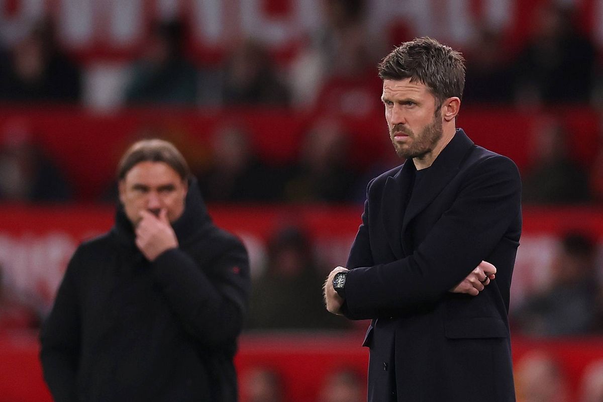 Michael Carrick looks on