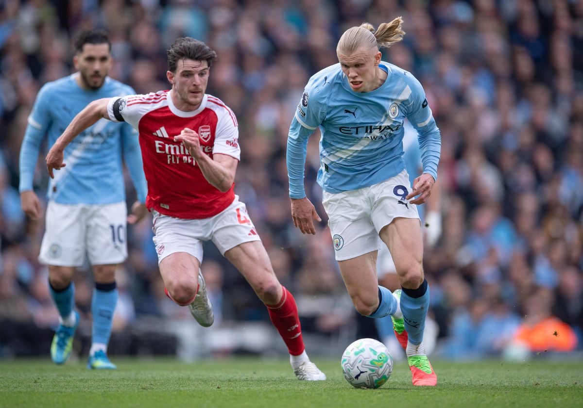 Erling Haaland of Manchester City and Declan Rice of Arsenal in action