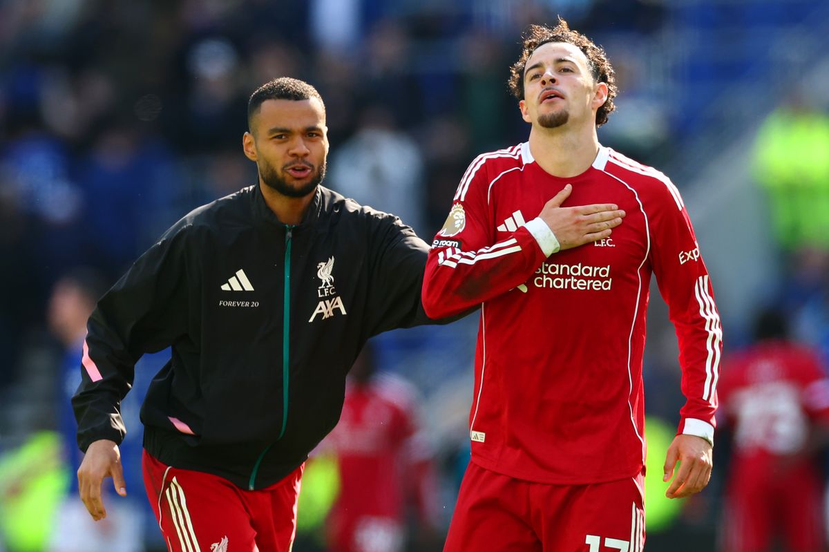 Curtis Jones of Liverpool celebrates at full-time following the Premier League match between Everton and Liverpool