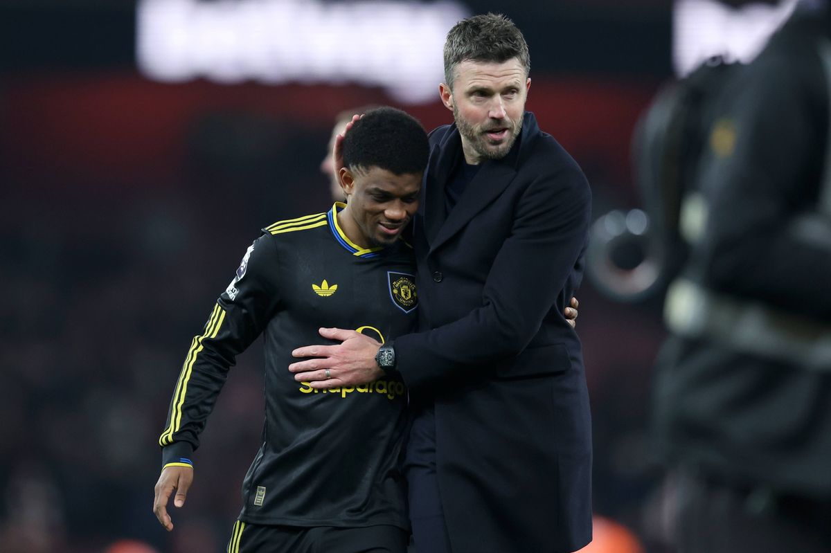 Amad embraces Michael Carrick