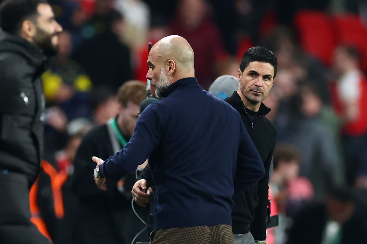 Pep Guardiola and Mikel Arteta look on