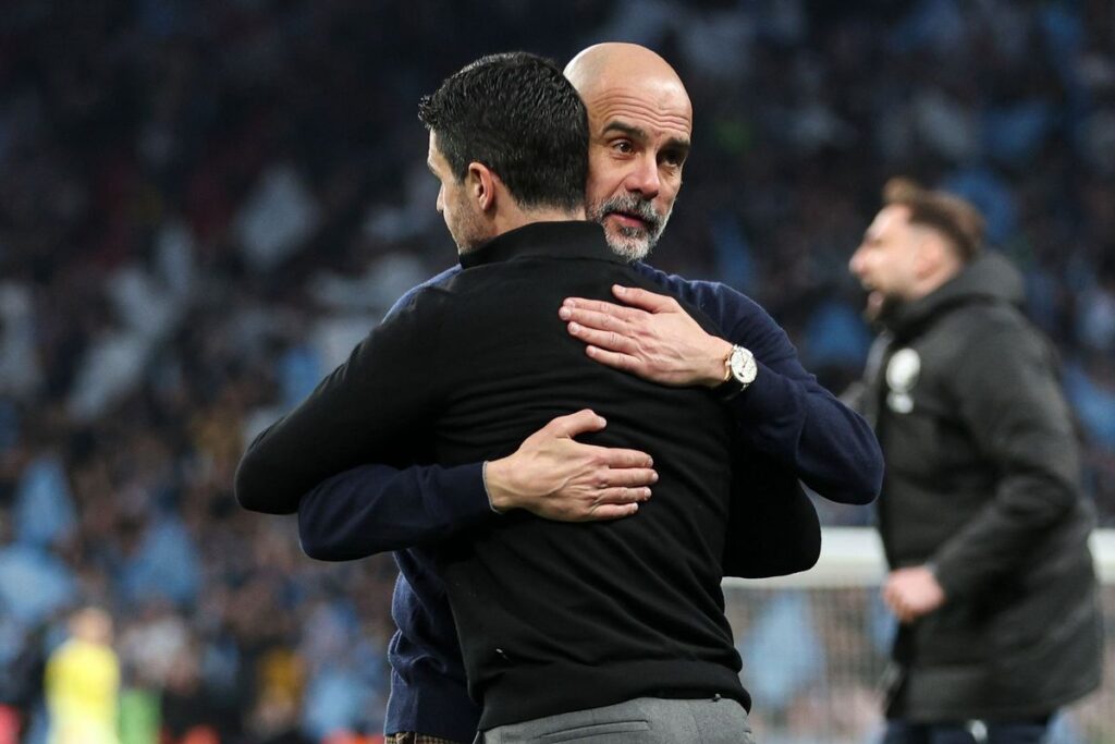 Pep Guardiola and Mikel Arteta embrace
