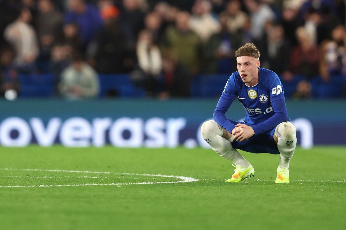 Cole Palmer squats on the pitch