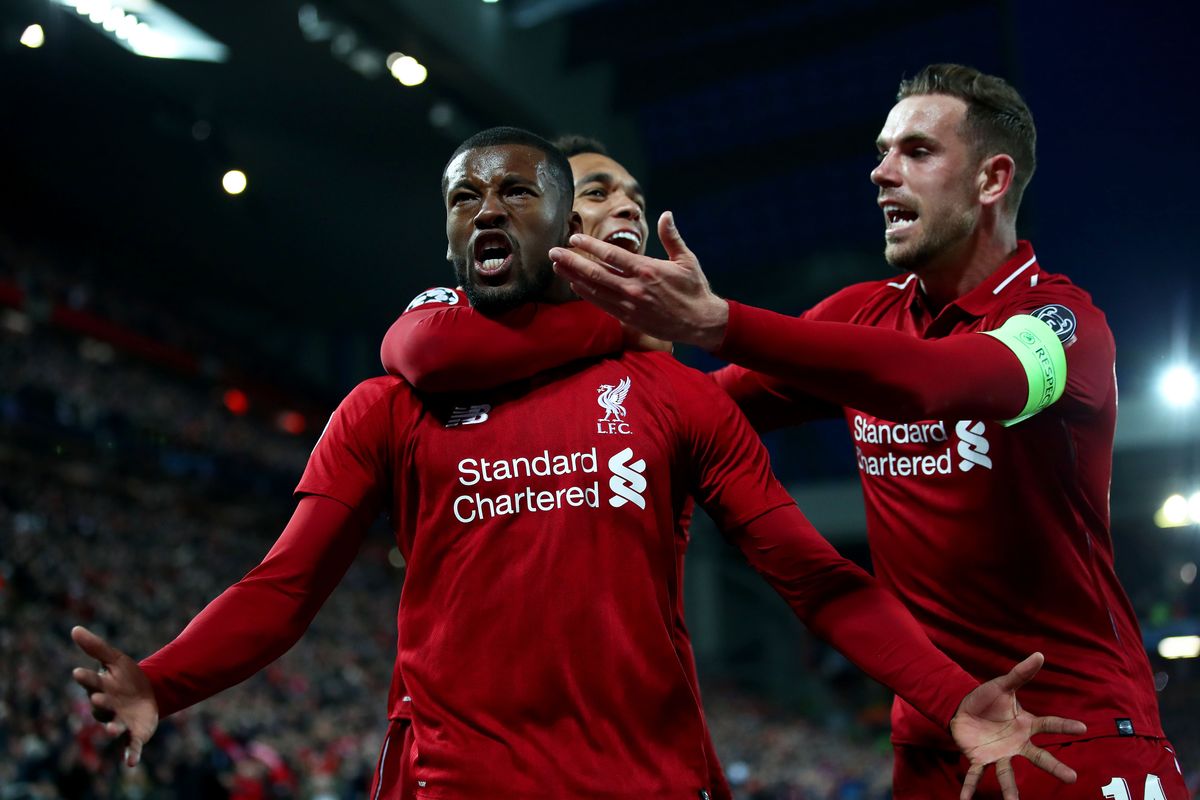 Georginio Wijnaldum celebrates with Jordan Henderson and Trent Alexander-Arnold