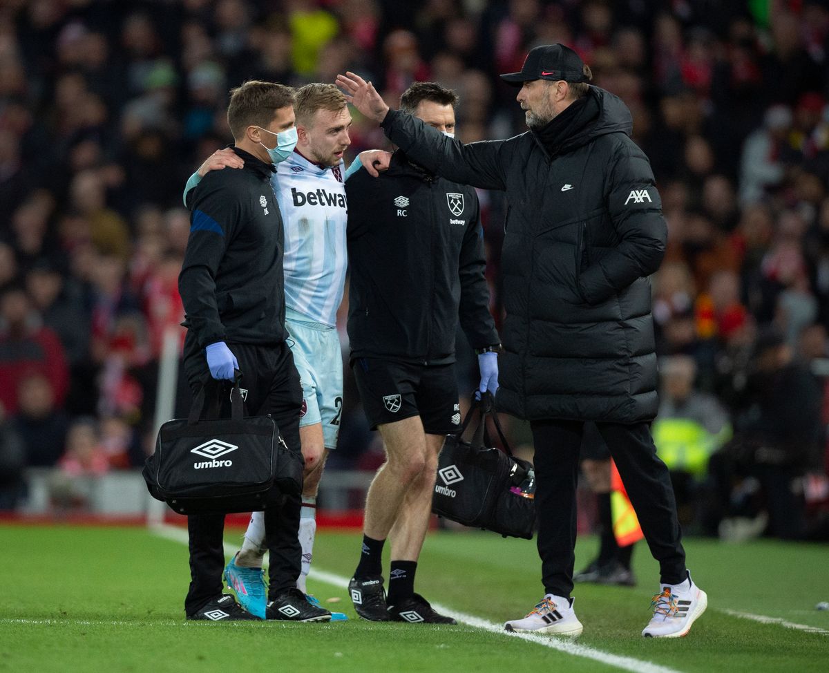  Jarrod Bowen of West Ham United is assisted off the pitch after getting injured and is met by Liverpool manager Jurgen Klopp 