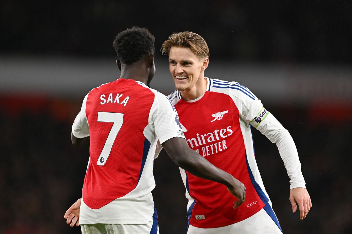 Bukayo Saka and Martin Odegaard of Arsenal celebrate after Thomas Partey of Arsenal (not pictured) scores his team's second goal during the Premier League match between Arsenal FC and Nottingham Forest