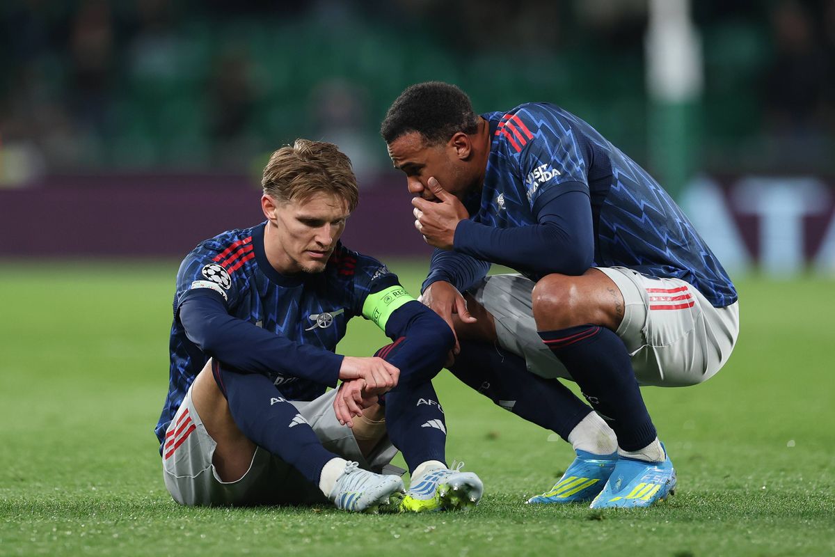 Martin Odegaard of Arsenal is spoken to by teammate Gabriel during the UEFA Champions League 2025/26 Quarter-Final First Leg match between Sporting Clube de Portugal and Arsenal FC at Estadio Jose Alvalade on April 07, 2026 in Lisbon, Portugal