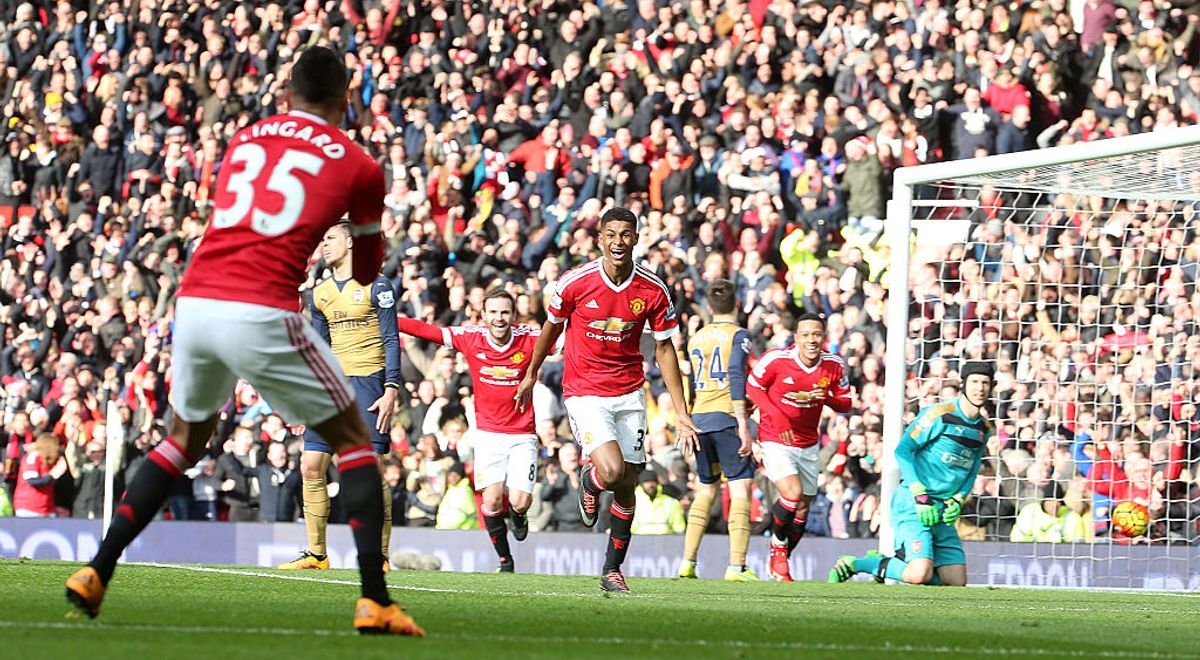 Marcus Rashford celebrates with team-mates during his Premier League debut against Arsenal in 2016