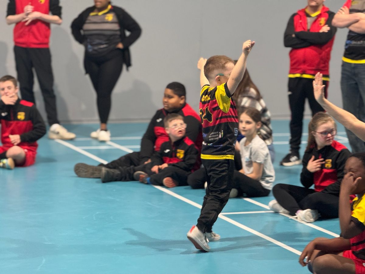 A child in celebration after scoring a penalty kick