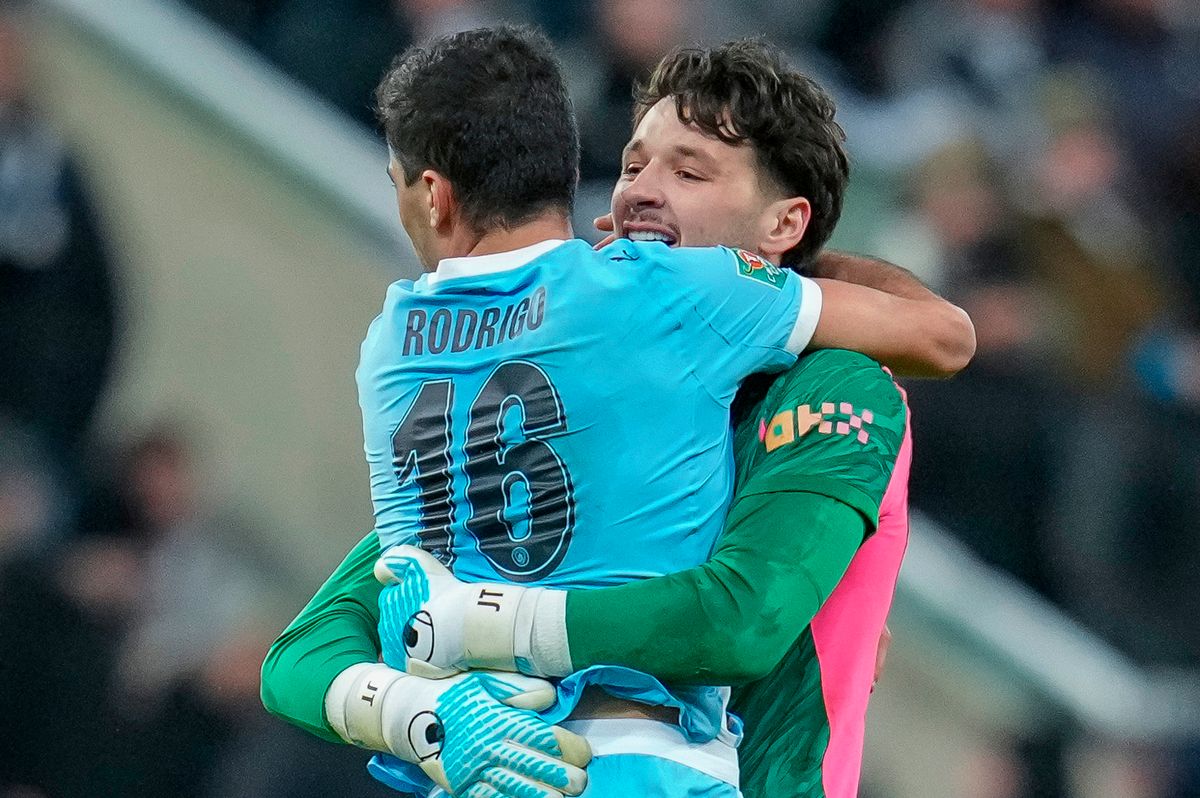 Rodri of Manchester City and James Trafford celebrate