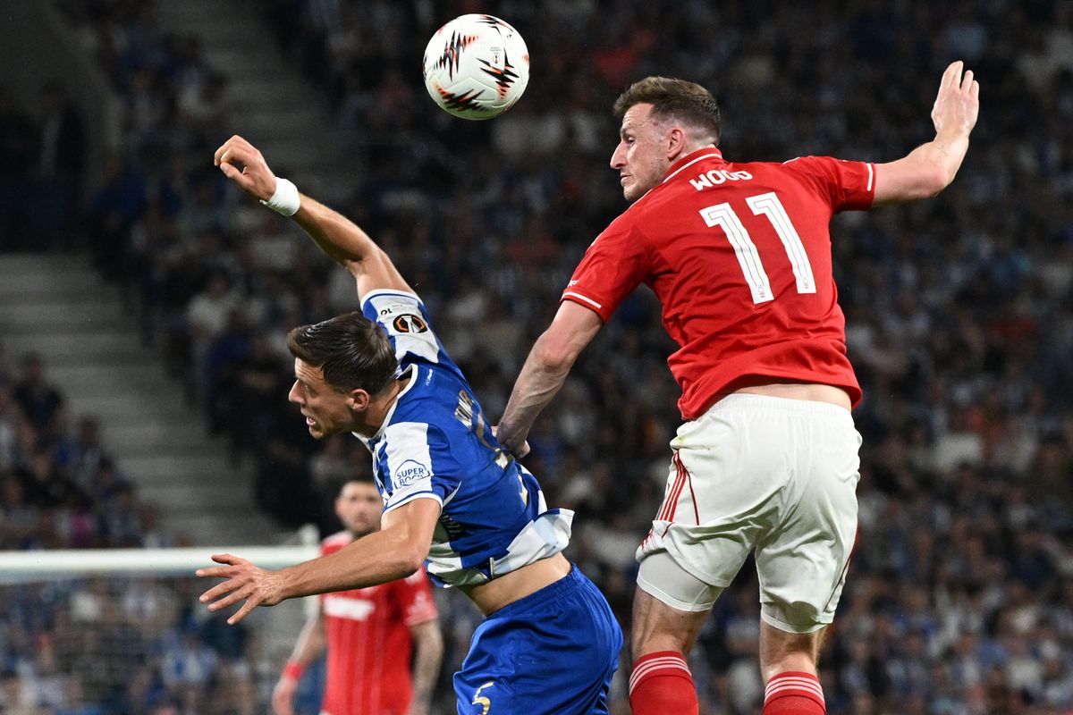 Nottingham Forest's Chris Wood and FC Porto's Jan Bednarek battle for the ball during the UEFA Europa League quarter final at Estadio do Dragao, Porto. 
