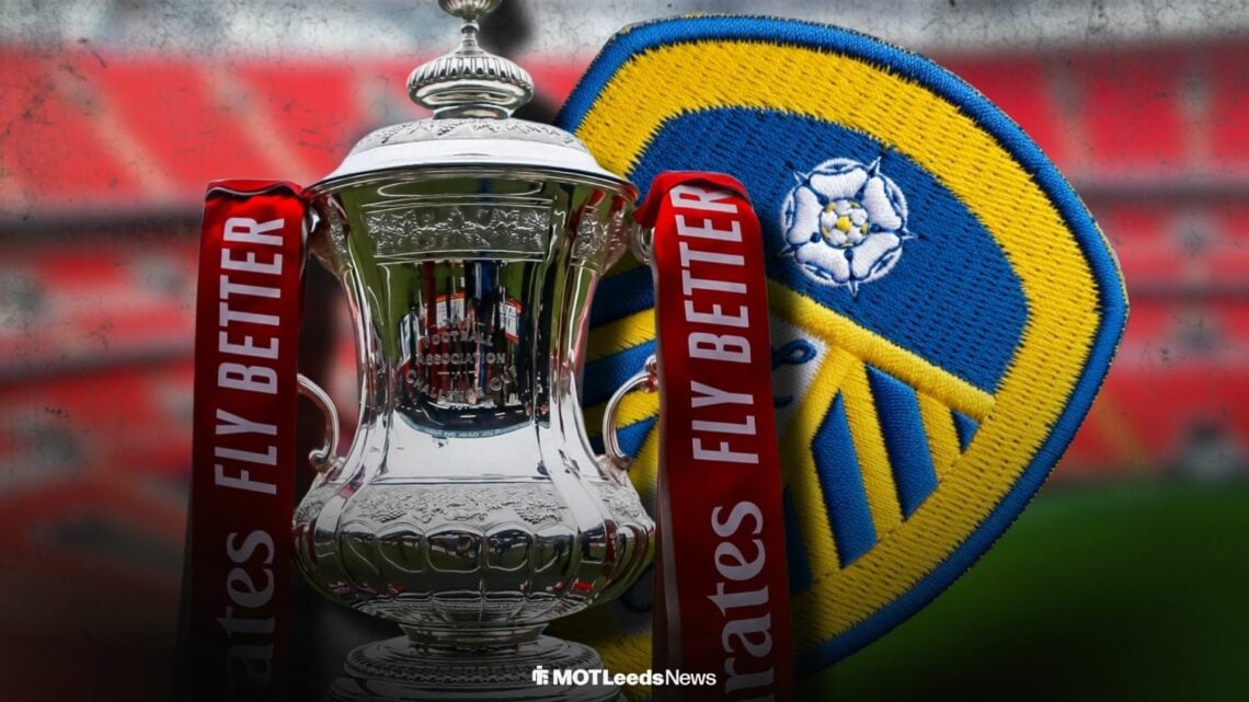 The FA Cup trophy next to a Leeds United badge at Wembley Stadium