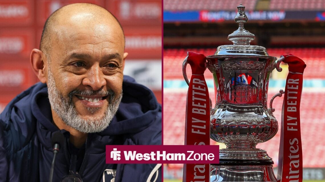 Nuno Espirito Santo smiling with FA Cup trophy alongside him