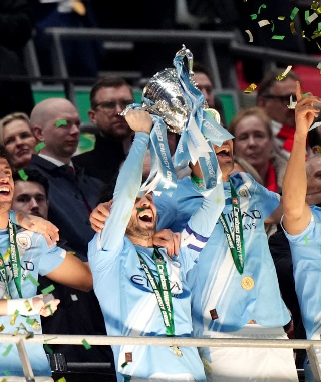 Manchester City’s Bernardo Silva lifts the trophy after winning the 2026 Carabao Cup final against Arsenal at Wembley