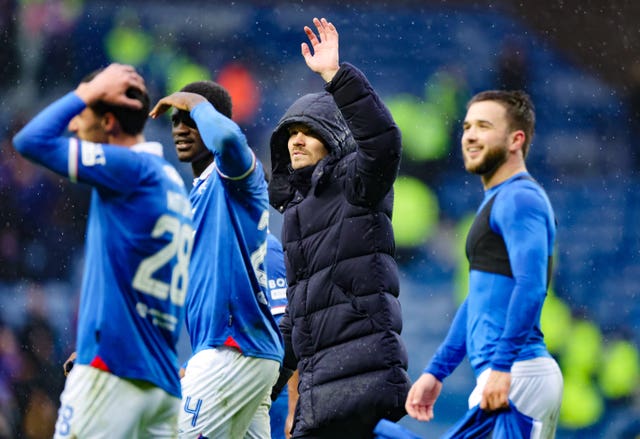 Danny Rohl, second right, waves to the Rangers fans