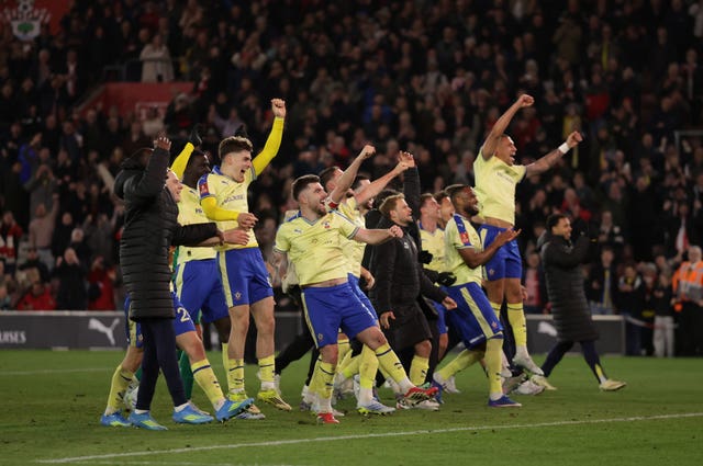 Southampton players celebrate on the final whistle after their 2-1 FA Cup quarter-final win over Arsenal