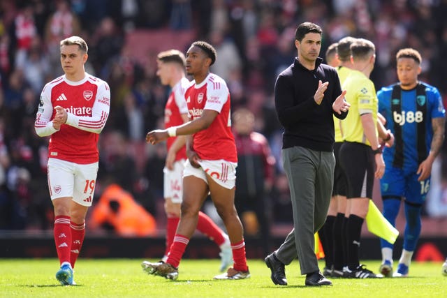 Arsenal’s Leandro Trossard (left) and manage Mikel Arteta applaud the fans following defeat by Bournemouth