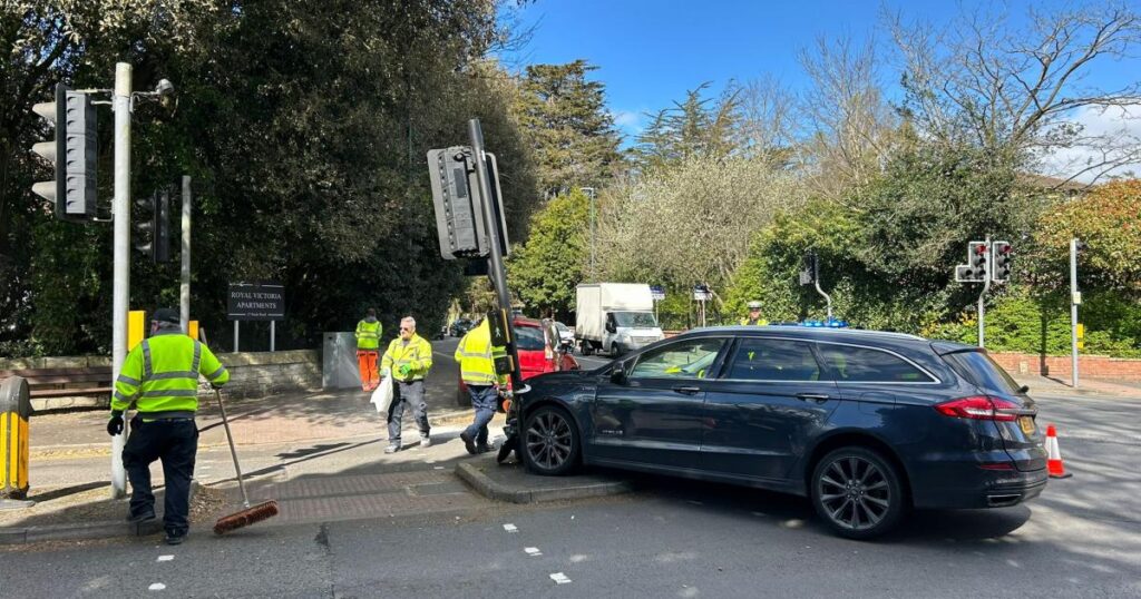 Car crashing into traffic light following multi-car crash Car crashing into traffic light following multi-car crash