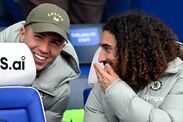 LONDON, ENGLAND - APRIL 04: Enzo Fernandez and Marc Cucurella of Chelsea interact on the bench prior to the Emirates FA Cup Quar