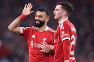 LIVERPOOL, ENGLAND - JANUARY 28: Mohamed Salah of Liverpool (L) celebrates with Andrew Robertson of Liverpool after scoring thei