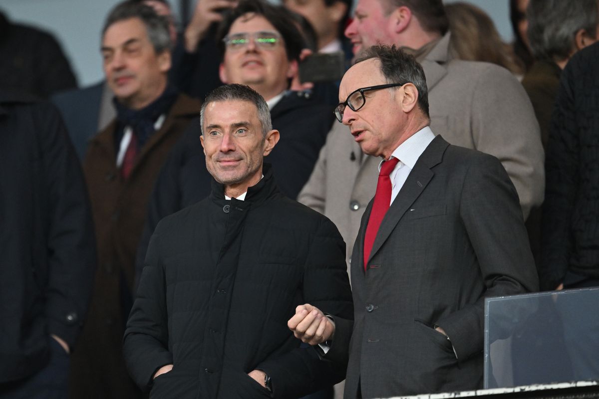 Andrea Berta, Sporting Director of Arsenal (L), speaks to Tim Lewis, Vice Chairman of Arsenal (R), in the stand prior to the Premier League match between Arsenal FC and Fulham FC at Emirates Stadium on April 01, 2025 in London, England