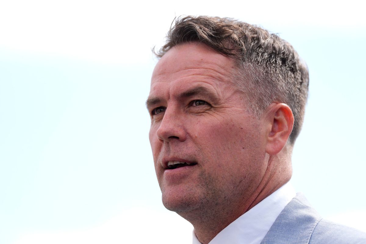 Michael Owen looks on