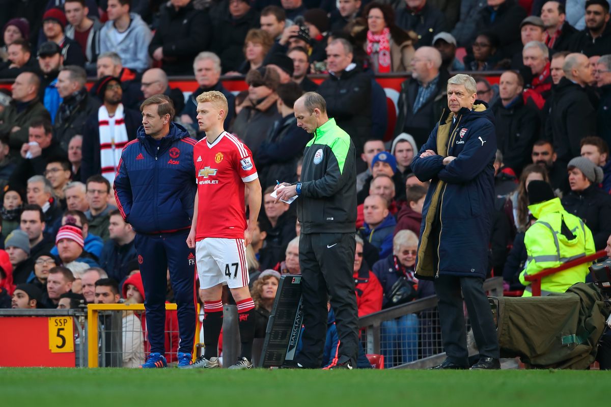  James Weir of Manchester United prepares to come on to the pitch as a substitute during the Barclays Premier League match between Manchester United and Arsenal