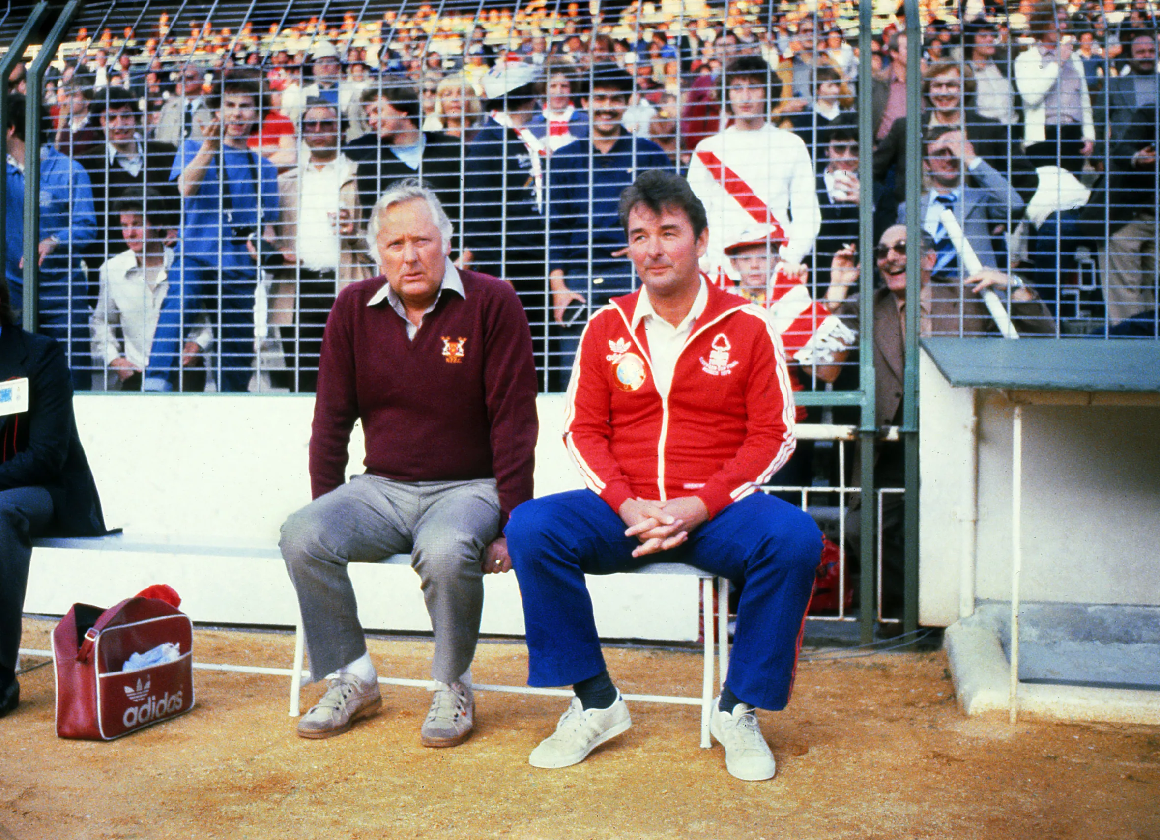 Nottingham Forest manager Brian Clough and assistant Peter Taylor sitting on a bench at the Santiago Bernabeu Stadium in Madrid.