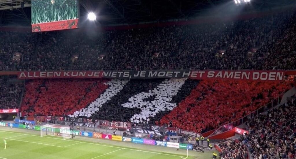 Ajax tifo honouring Johan Cruijff in the 14th minute.