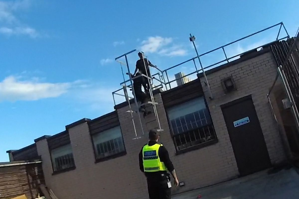 Photo shows the offenders on the roof of a building