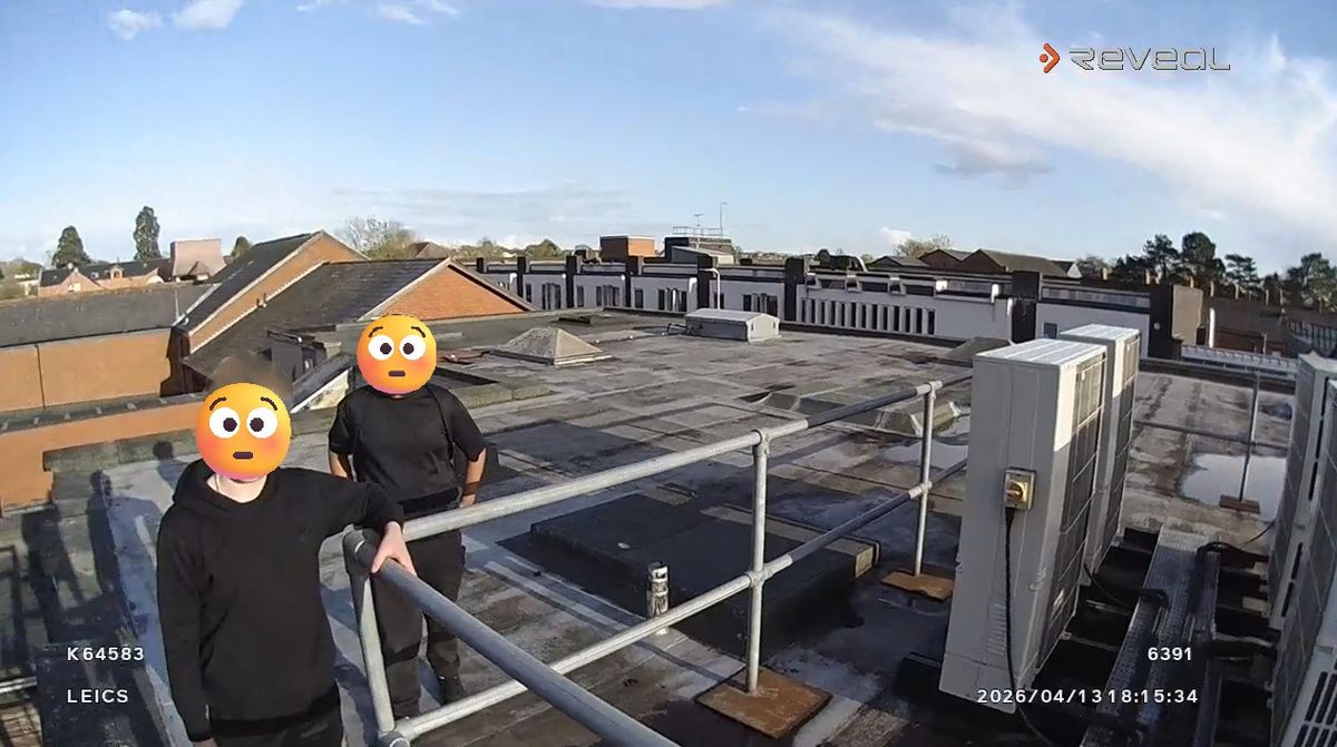Photo shows the youths on the roof of a building