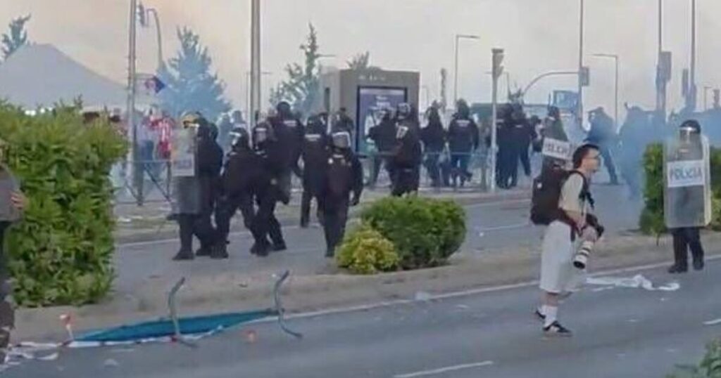Arsenal fans tear-gassed by police as violence breaks out in Atletico tie