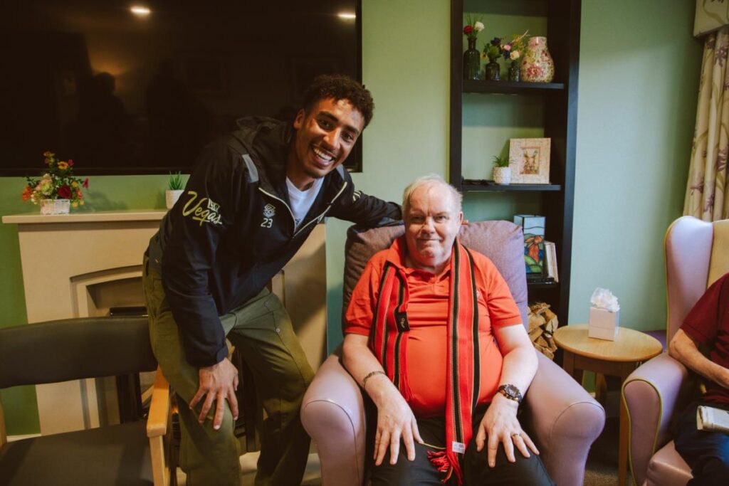 Lifelong Cherries fan meets player during AFC Bournemouth event at care home