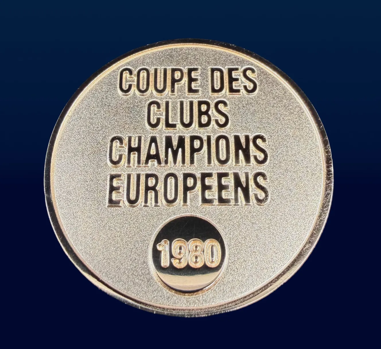 Gold "Coupe des Clubs Champions Europeens 1980" medal.