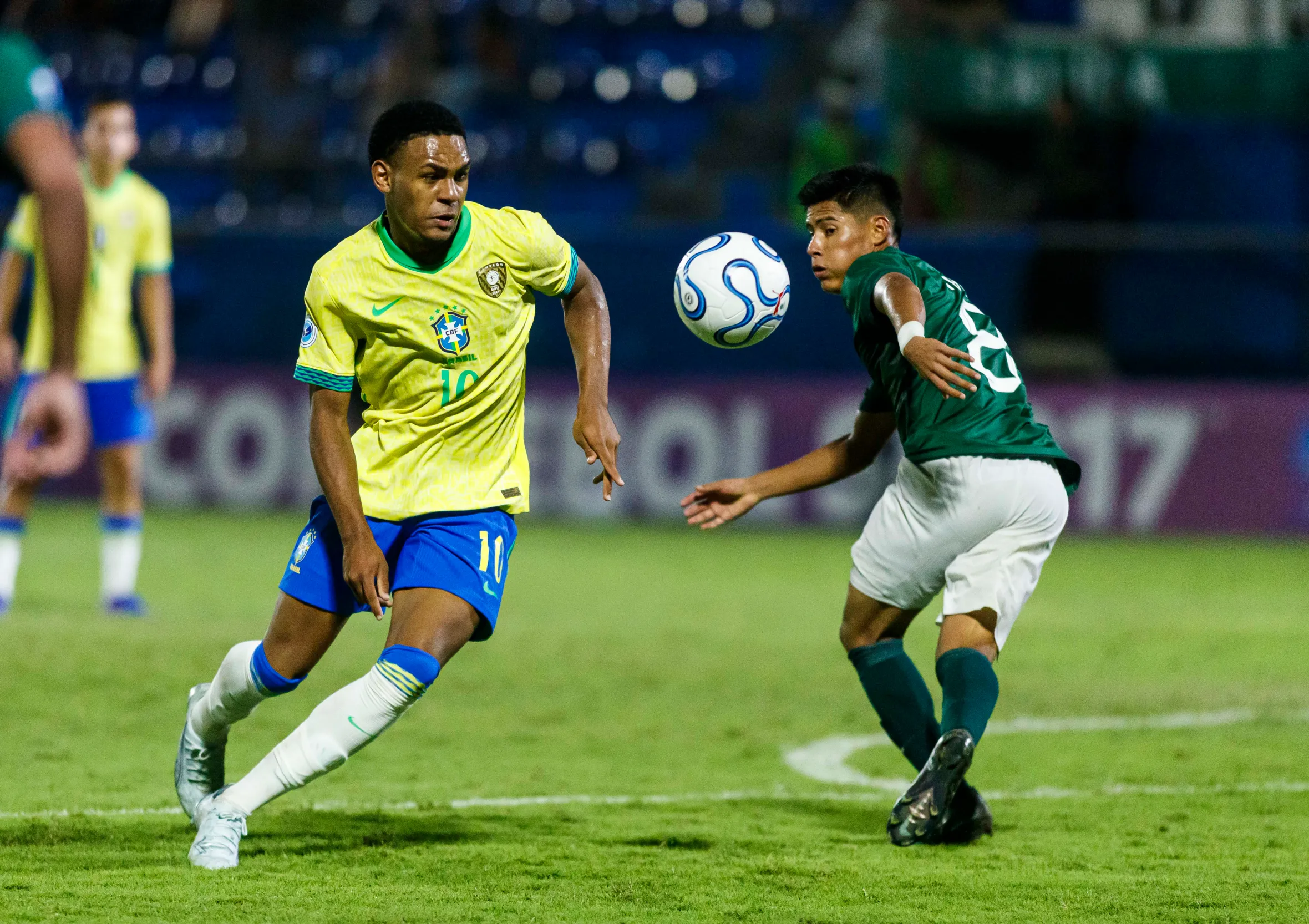 Eduardo Conceicao of Brazil and Quimey Vasco of Bolivia compete for the ball during a FIFA U17 World Cup 2026 Qualifier.