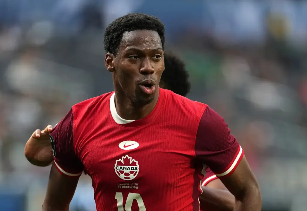 Jonathan David runs while in action for Canada