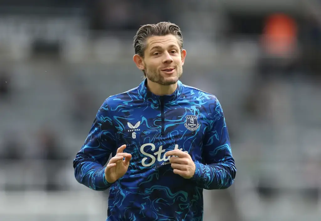 James Tarkowski warms up for Everton before a match