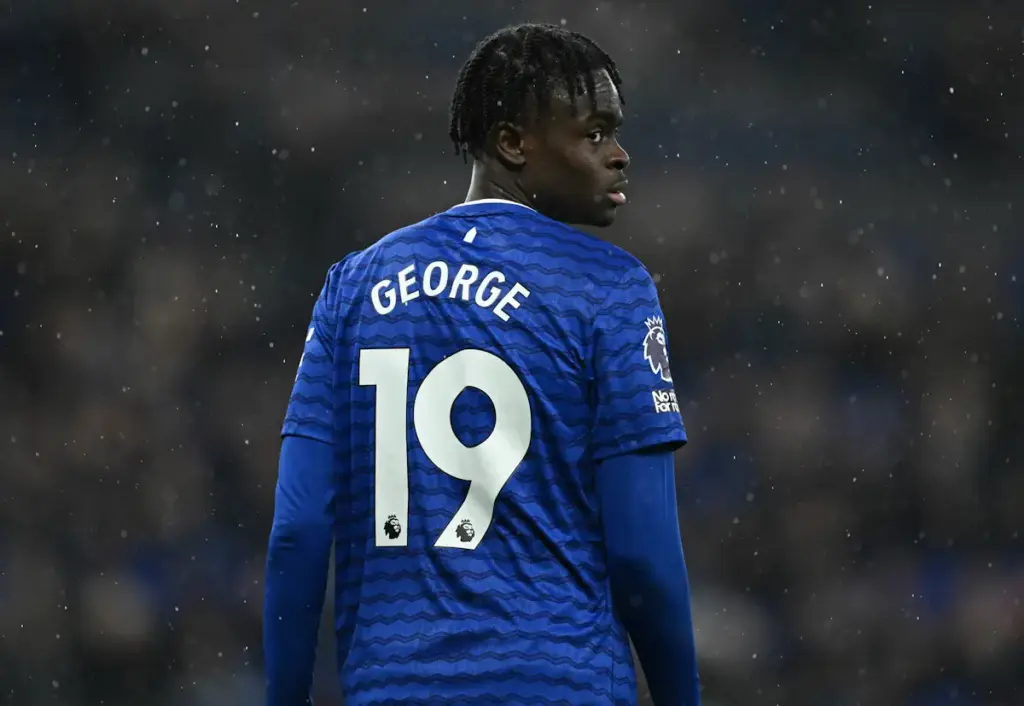 Tyrique George looks over his shoulder while playing for Everton with his shirt number and name visible