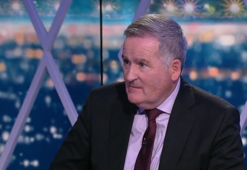 Richard Keys asks a question in the TV studio and waits for an answer