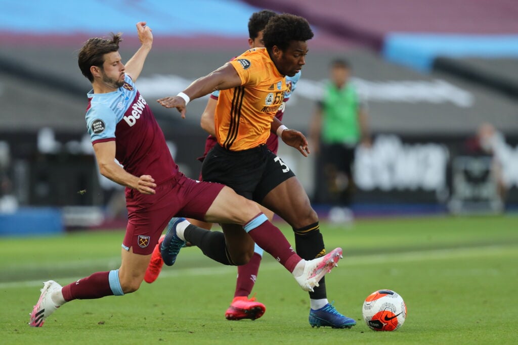 Aaron Cresswell and Adama Traore during West Ham United v Wolverhampton Wanderers - Premier League