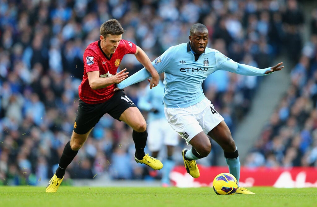 Yaya Toure competes with Michael Carrick during the Barclays Premier League match between Manchester City and Manchester United at the Etihad Stadium in 2012 in Manchester, England.