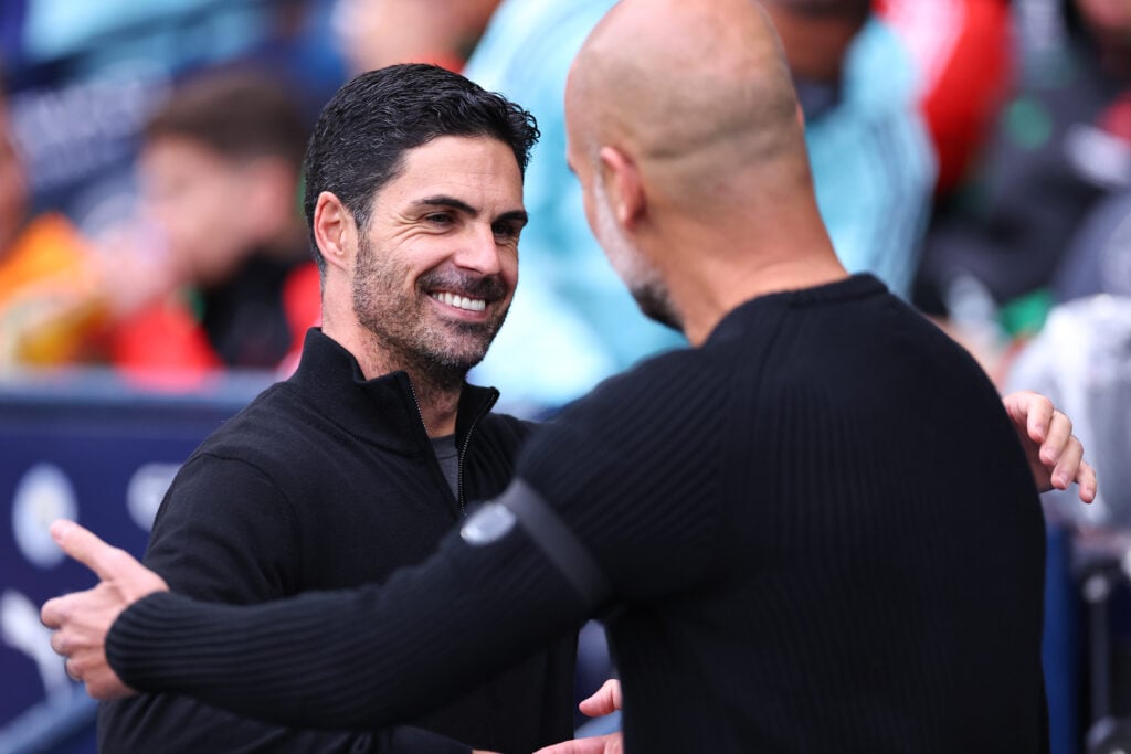 Mikel Arteta and Pep Guardiola shake hands during Man City vs Arsenal