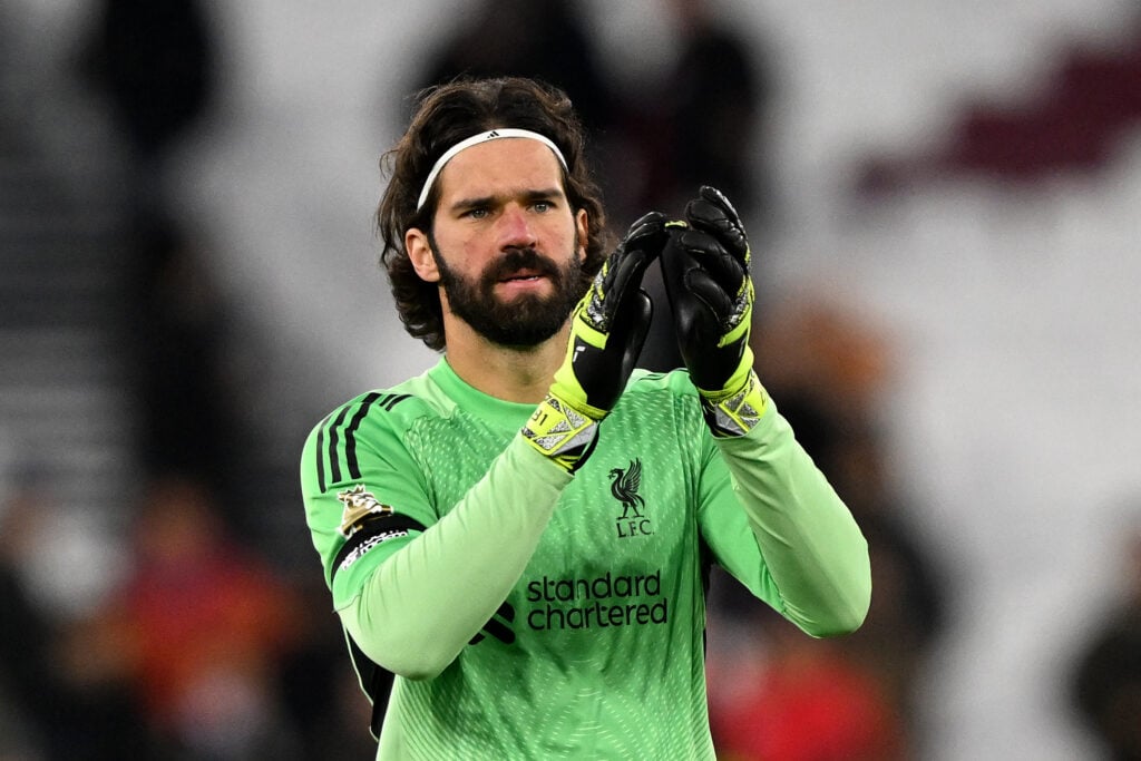 Alisson Becker applauds after Liverpool's Premier League match against West Ham United at the London Stadium.