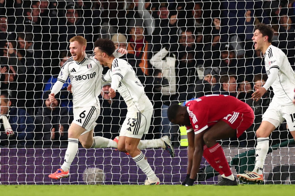 Harrison Reed and Antonee Robinson celebrate after Reed scores against Liverpool for Fulham in the Premier League at Craven Cottage.